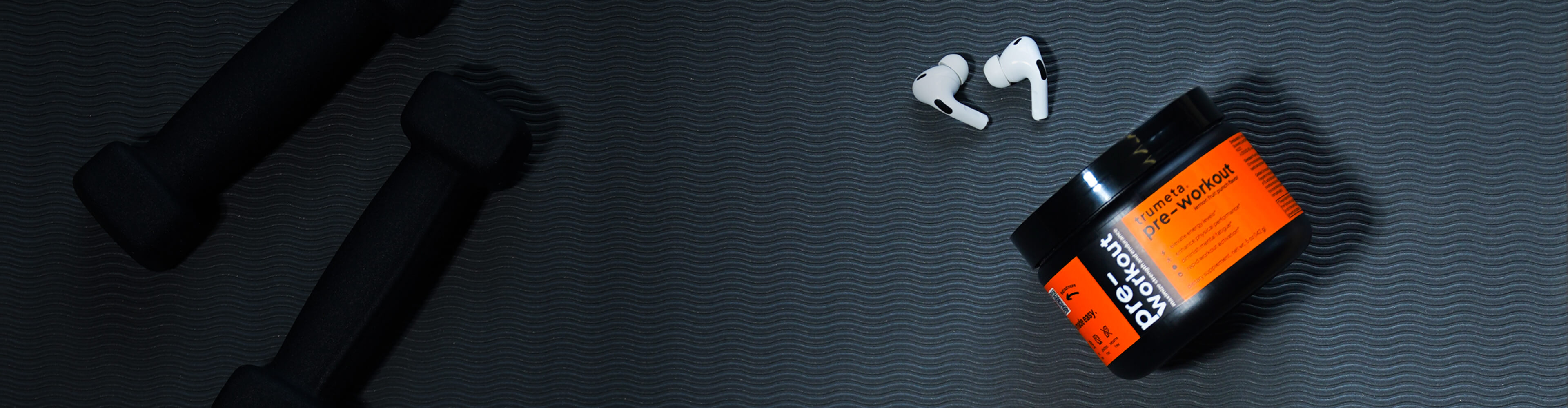 pre-workout jar and headphones